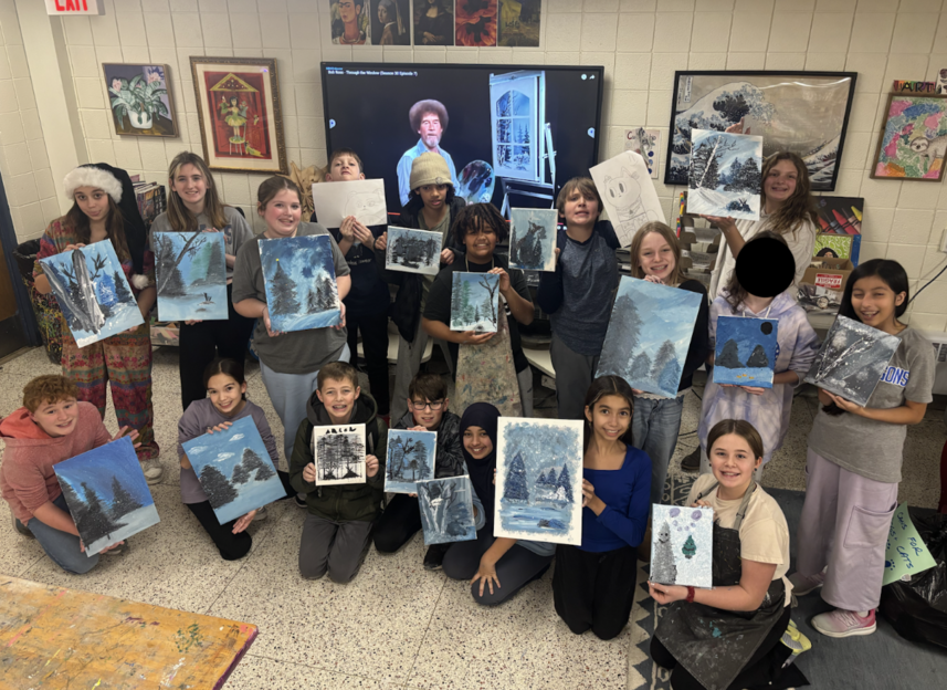 Students in art holding their painted canvases featuring winter tree scenes.