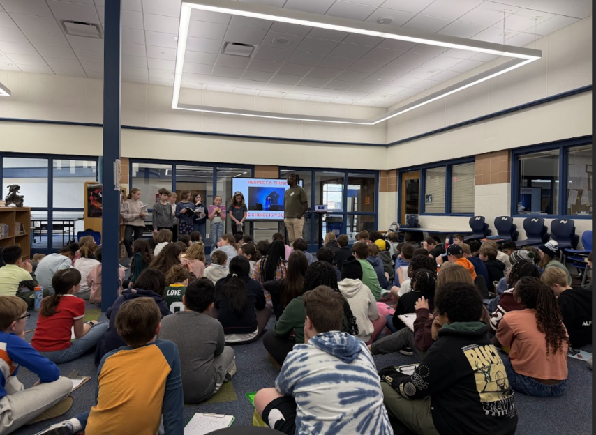 Author Baptiste Paul working with Maple Dale students.